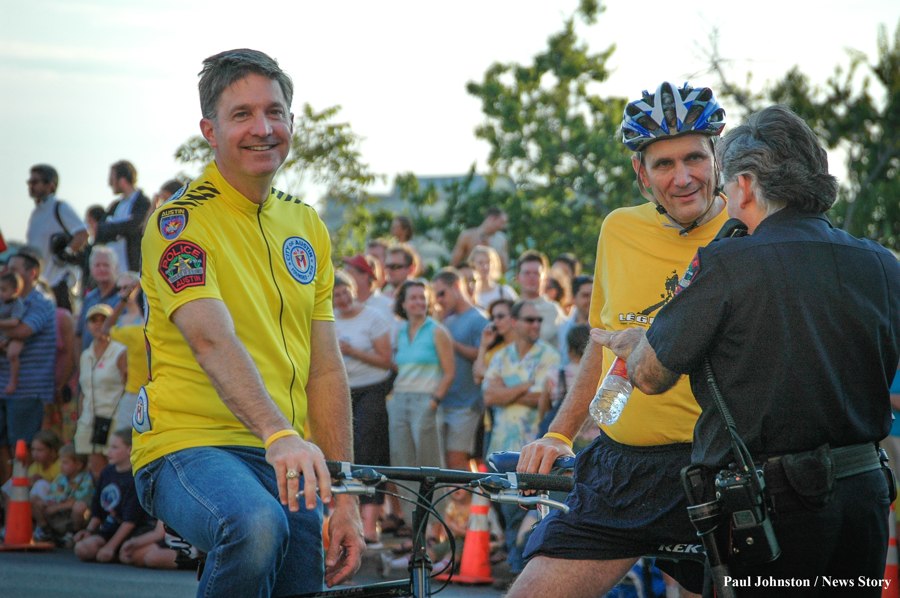 Austin Mayor Will Wynn (left) and Congressman Lloyd Doggett (right) participate in the bicycle parade in honor of Lance Armstrong on August 13, 2004 in Austin, Texas.  Copyright - Paul Johnston / Austin News Story - austinnewsstory.com